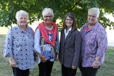Four new Associates: Mary Ann Dorcey, Denise (Neece) Bowyer, Donna Fleming-Alcocer, and Linda Leonard.